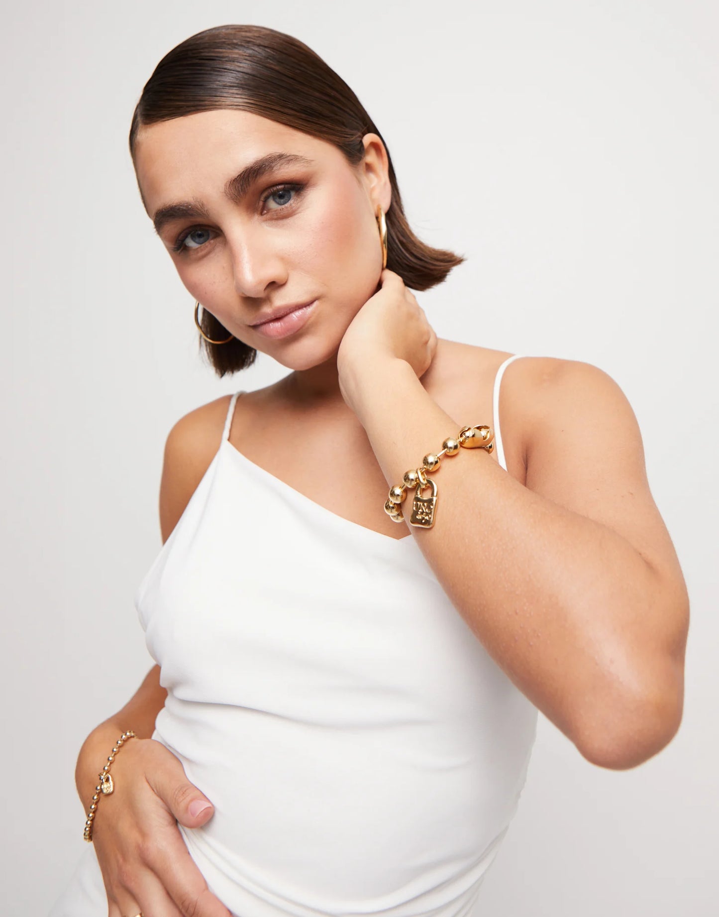 Beaded bracelet with a padlock charm - Gold